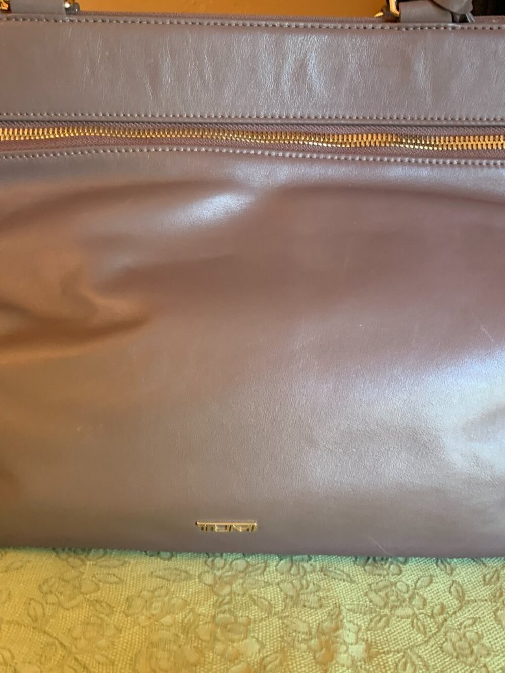 Tumi Tote Bag. !7" x 14"  Leather Taupe